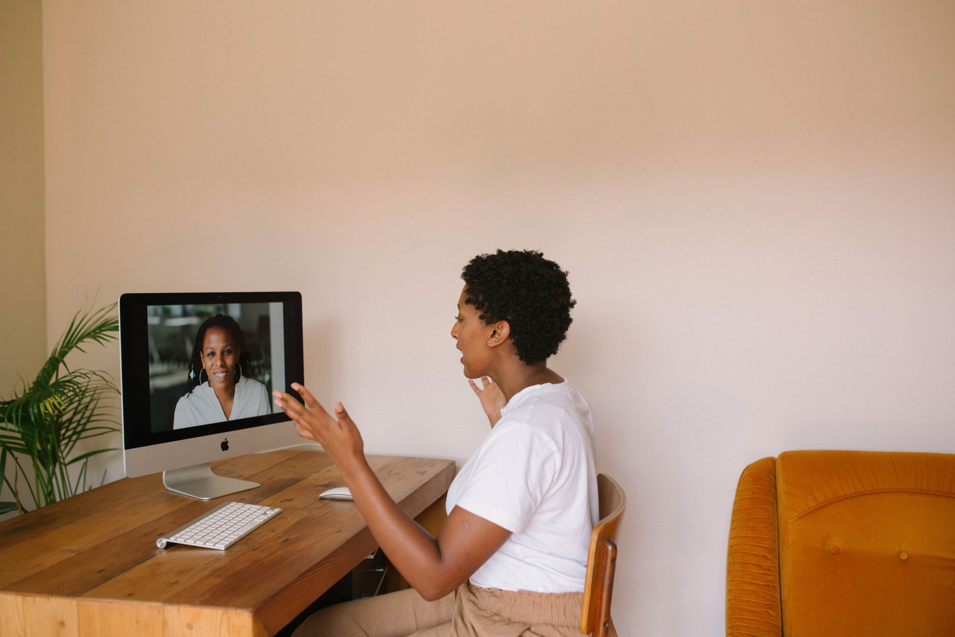 Woman Having Virtual Meeting with Colleagues on Computer